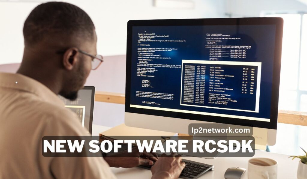 "Developer working on a desktop computer displaying code with the text overlay ‘New Software RCSdk’ – Ip2network.com"